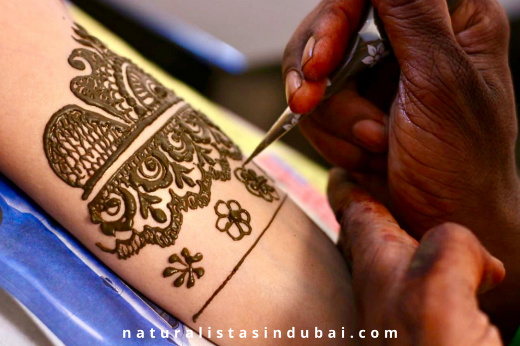 henna being applied to hands